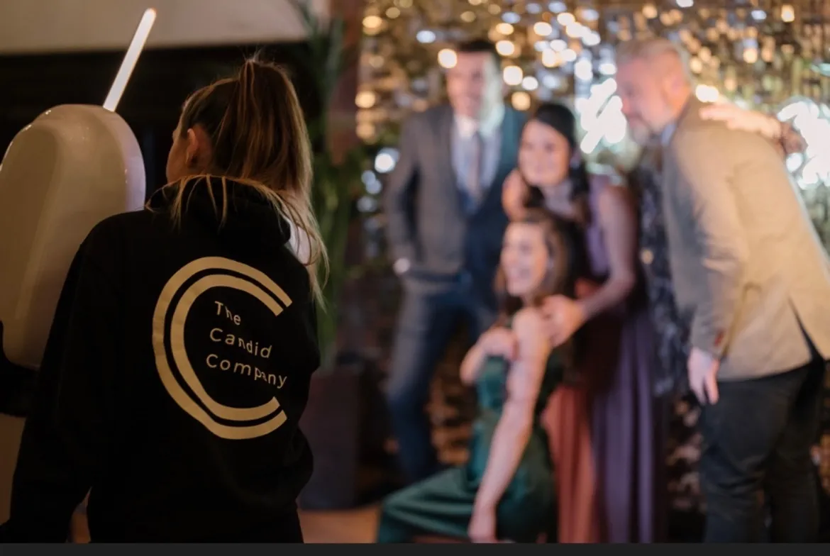 candid company operator guiding wedding guests